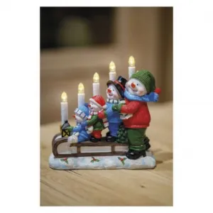 EMOS LED svietnik – snehuliaci na saniach, 24 cm, 2x AA, vnútorný, teplá biela, časovač