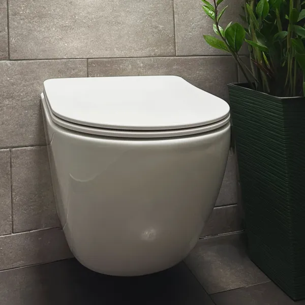 REA - Závesná WC misa vrátane sedátka Carlo Mini Tornado Rimless Slim N REA-C1259
