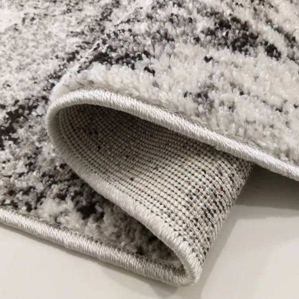 BrilatnýbéžovohnedýkoberecsjemnýmabstraktnýmmotívomŠírka:80cm|Dĺžka:150cm45251_91656