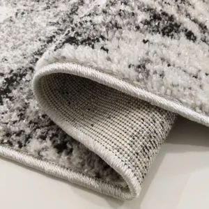 BrilatnýbéžovohnedýkoberecsjemnýmabstraktnýmmotívomŠírka:80cm|Dĺžka:150cm45251_91656