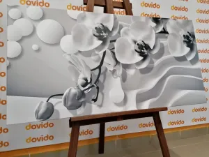 Obraz čiernobiela orchidea na abstraktnom pozadí