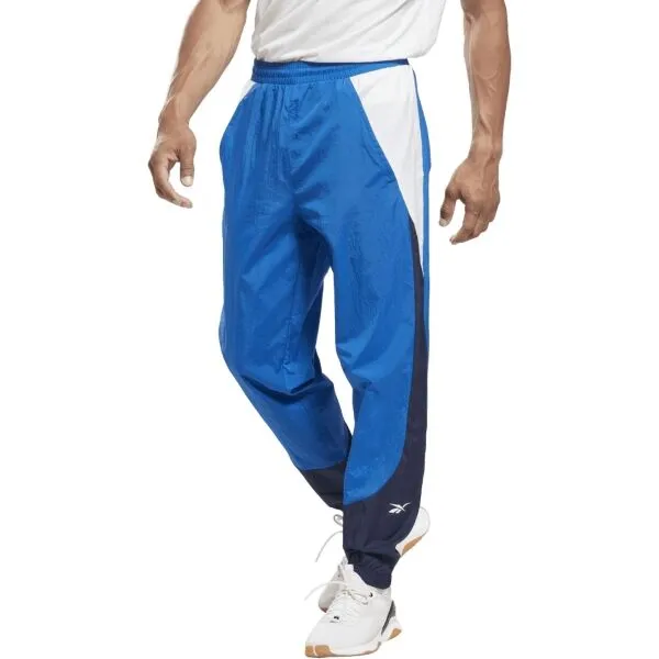 Reebok TRAIN WOVEN PANT Pánske šuštiakové nohavice, modrá, veľkosť