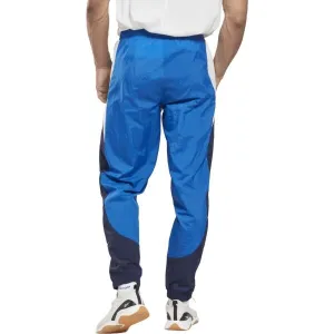 Reebok TRAIN WOVEN PANT Pánske šuštiakové nohavice, modrá, veľkosť
