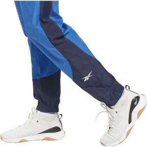 Reebok TRAIN WOVEN PANT Pánske šuštiakové nohavice, modrá, veľkosť