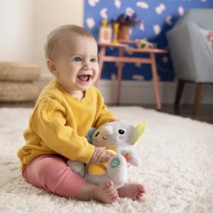 BRIGHT STARTS Hračka plyšová hudobná svietiaca Hug-a-bye Baby™ sloník 0m+