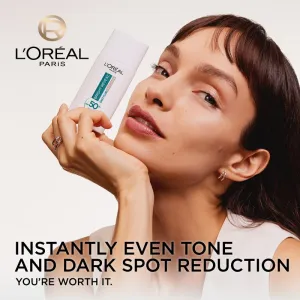 L’Oréal Paris Bright Reveal rozjasňujúci tónovací fluid proti tmavým škvrnám SPF 50+ 50 ml