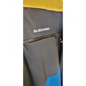 Pánska lyžiarska bunda s kapucňou BLIZZARD Ski Jacket Leogang, petroleum mustard yellow