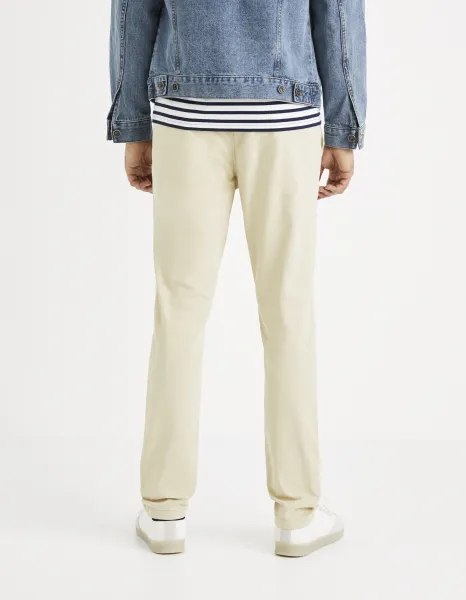 Krémové chino nohavice Celio Roprime