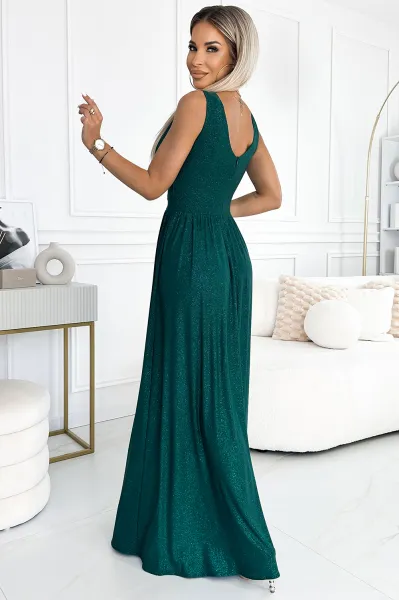Long brocade dress with neckline and stitching at the waist Numoco