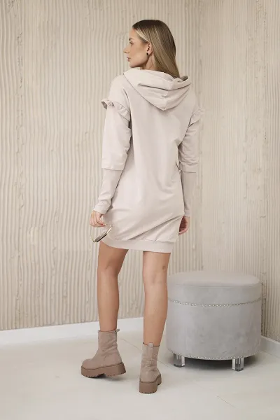 Dress with decorative ruffles and beige hood