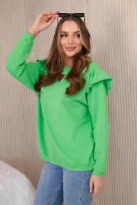 Cotton blouse with ruffles on the shoulders in light green color