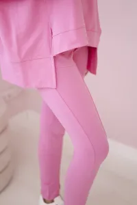 Complete with an oversized blouse in light pink color