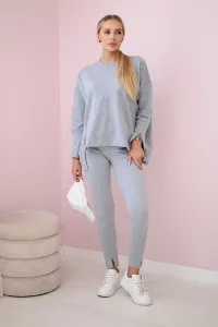 Complete with an oversized blouse in gray color