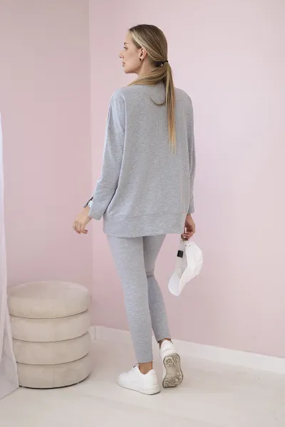 Complete with an oversized blouse in gray color