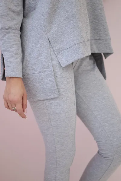 Complete with an oversized blouse in gray color