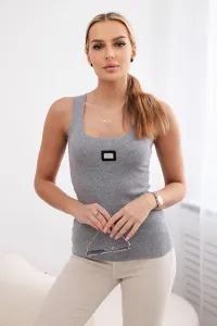 Striped blouse with a gray metal plate