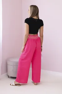 Trousers with a wide elastic waistband in pink color
