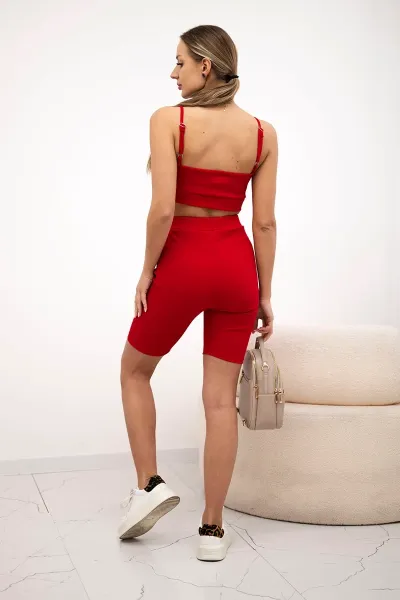 Complete with red high-waisted trousers