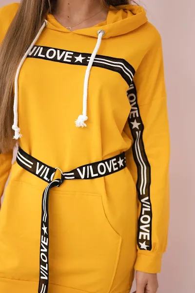Dress decorated with a mustard inscription tape