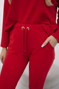 Complete with an oversized blouse in red