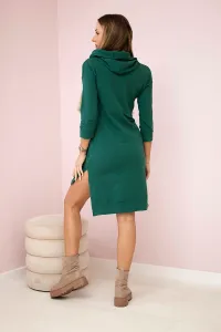 Dress with a longer back and a colorful print in dark green