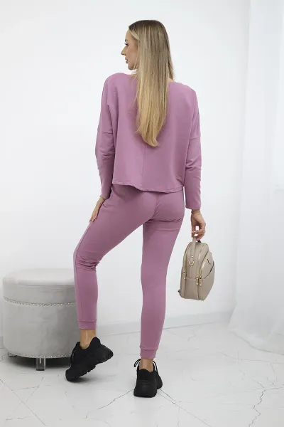 Complete with an oversized blouse in dark pink