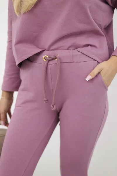 Complete with an oversized blouse in dark pink