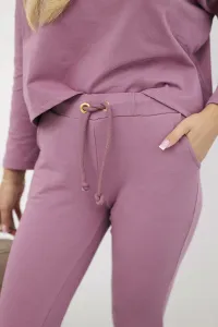 Complete with an oversized blouse in dark pink