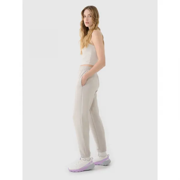 Dámske tepláky 4F TROUSERS CAS F1010-83S-BEIGE