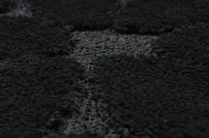 Kúpeľňový koberček SUPREME STONES kamienky, čierny kruh