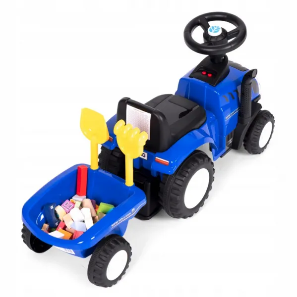 ModrýtraktorNEWHOLLANDsvlečkouanáradim