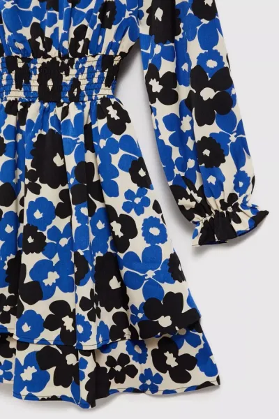 Marisse Blue Dress With A Flared Bottom And A Floral Pattern