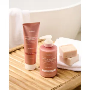 KUNDAL Protein Bonding Care Shampoo vyživujúci šampón pre suché a poškodené vlasy s vôňou Violet Muguet 500 ml