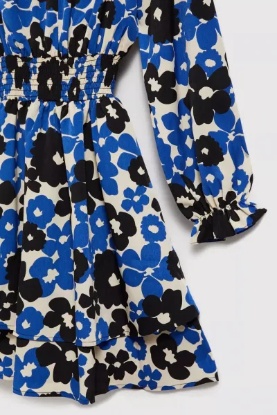 Marisse Blue Dress With A Flared Bottom And A Floral Pattern