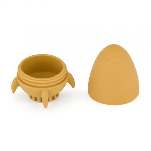 PETITE&MARS Hračka silikónová do vody s kefkou Splashy Rocket Intense Ochre 6m+
