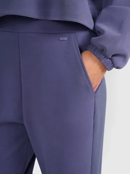 Dámske tepláky 4F TROUSERS CAS F1180-WAW25TTROF1180-32S-DENIM