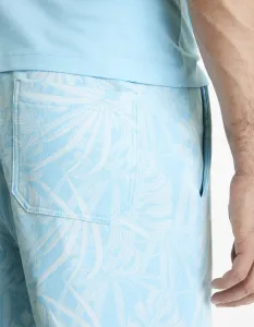 Svetlomodré pánske vzorované teplákové kraťasy Celio Doplaced