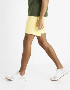 Žlté pánske teplákové kraťasy Celio Toshort