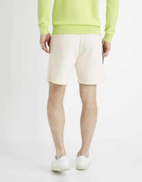Krémové pánske teplákové kraťasy Celio Donewshort