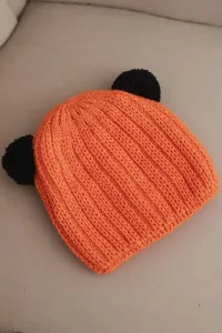 Dámska zimná čiapka s brmbolcami Kesi K433 oranžová