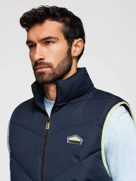 Ombre Men's quilted sleeveless jacket with neon accents - navy blue